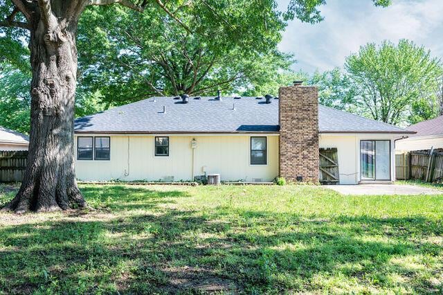 2812 W Maplewood St, Springfield, MO 65807 - back of house featuring a chimney and a patio