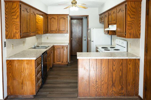 2812 W Maplewood St, Springfield, MO 65807 - kitchen featuring stove, under cabinet range hood, ceiling fan, light countertops, and decorative backsplash