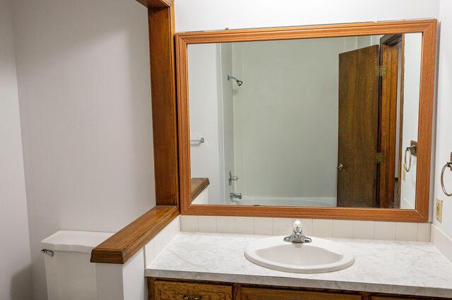 2812 W Maplewood St, Springfield, MO 65807 - bathroom featuring vanity and toilet