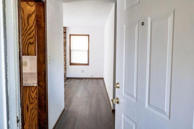 2812 W Maplewood St, Springfield, MO 65807 - corridor with dark wood-type flooring and baseboards