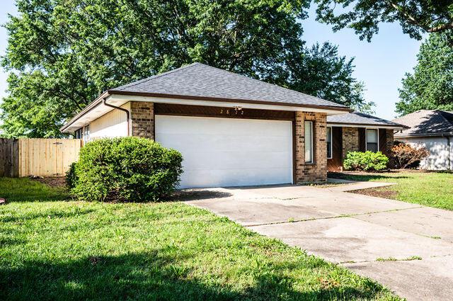 2812 W Maplewood St, Springfield, MO 65807 - ranch-style house with concrete driveway, an attached garage, and brick siding