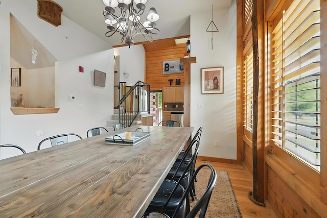 109 Grand Mountain Ave Unit 39-1, Branson, MO 65616 - dining area with light wood-style flooring, a chandelier, stairs, and lofted ceiling