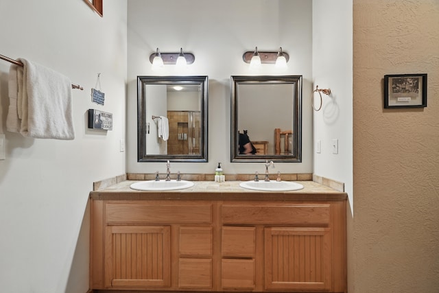 109 Grand Mountain Ave Unit 39-1, Branson, MO 65616 - bathroom featuring double vanity and a textured wall