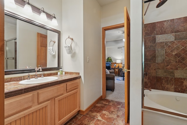 109 Grand Mountain Ave Unit 39-1, Branson, MO 65616 - full bathroom featuring vanity, stone finish floors,  shower combination, and connected bathroom
