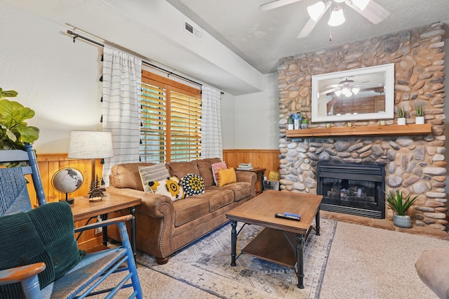 109 Grand Mountain Ave Unit 39-1, Branson, MO 65616 - living area with a wainscoted wall, ceiling fan, wood walls, and a fireplace