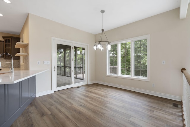 1007 Silvercrest Pl, Reeds Spring, MO 65737 - unfurnished dining area with wood finished floors, plenty of natural light, a chandelier, and recessed lighting