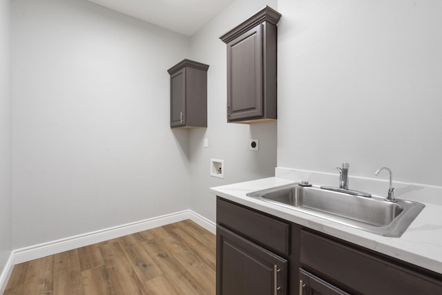 1007 Silvercrest Pl, Reeds Spring, MO 65737 - laundry room with hookup for an electric dryer, washer hookup, cabinet space, and light wood-type flooring
