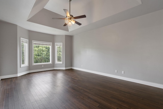 1007 Silvercrest Pl, Reeds Spring, MO 65737 - spare room with a raised ceiling, dark wood-type flooring, and ceiling fan
