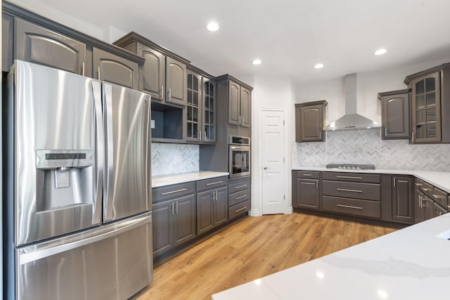 1007 Silvercrest Pl, Reeds Spring, MO 65737 - kitchen featuring stainless steel appliances, wall chimney exhaust hood, glass insert cabinets, backsplash, and recessed lighting
