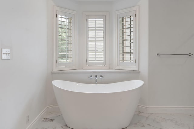 1007 Silvercrest Pl, Reeds Spring, MO 65737 - full bathroom featuring marble finish floors, a soaking tub, and healthy amount of natural light