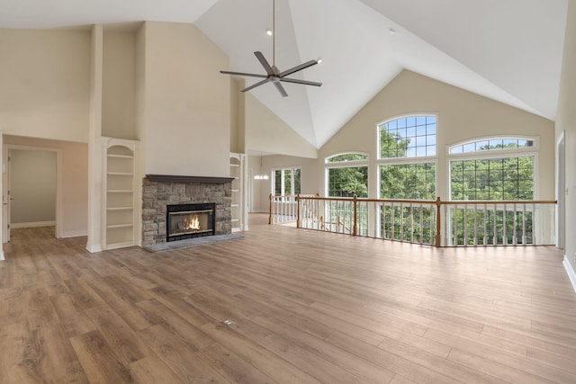 1007 Silvercrest Pl, Reeds Spring, MO 65737 - unfurnished living room featuring high vaulted ceiling, ceiling fan, wood finished floors, and a fireplace