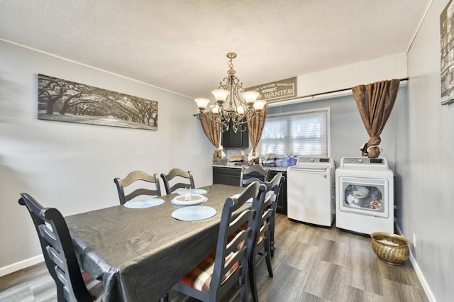 3153 W Washita St, Springfield, MO 65807 - dining space featuring washer and dryer, a chandelier, light wood-style floors, and a textured ceiling