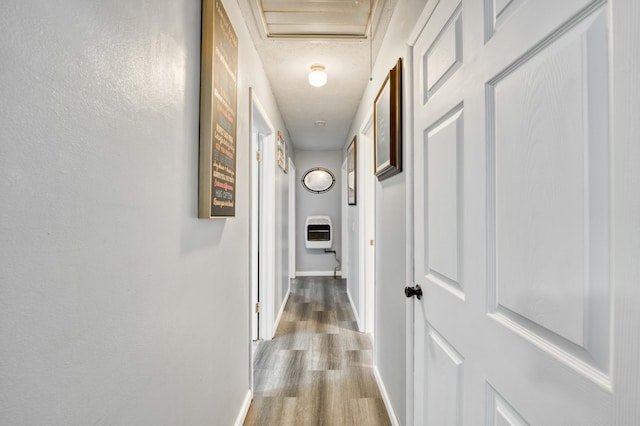 3153 W Washita St, Springfield, MO 65807 - hallway featuring heating unit, wood finished floors, and attic access