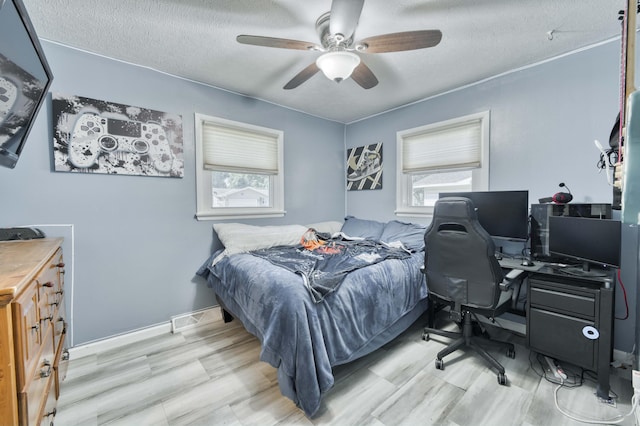 3153 W Washita St, Springfield, MO 65807 - bedroom featuring a textured ceiling, ceiling fan, and a desk