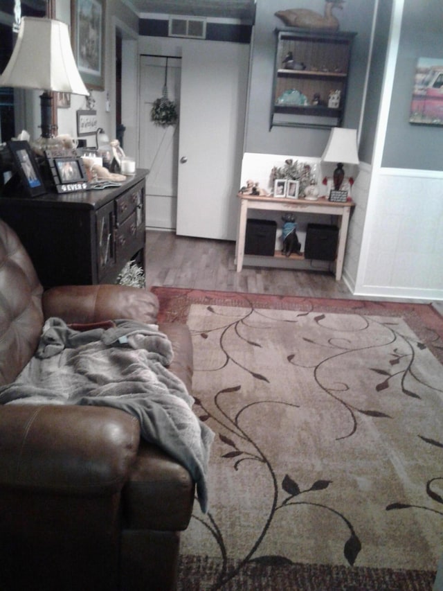 701 Spears Ave, Crane, MO 65633 - living area with wood finished floors and a wainscoted wall