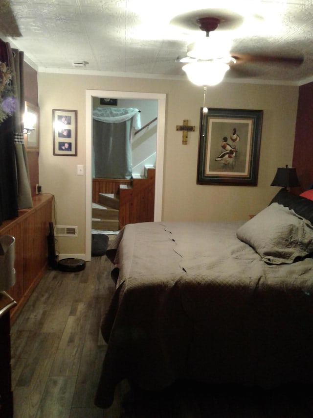 701 Spears Ave, Crane, MO 65633 - bedroom with wood finished floors and ornamental molding