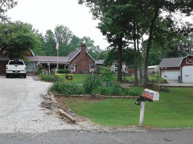 701 Spears Ave, Crane, MO 65633 - ranch-style house with a chimney, a front yard, and gravel driveway