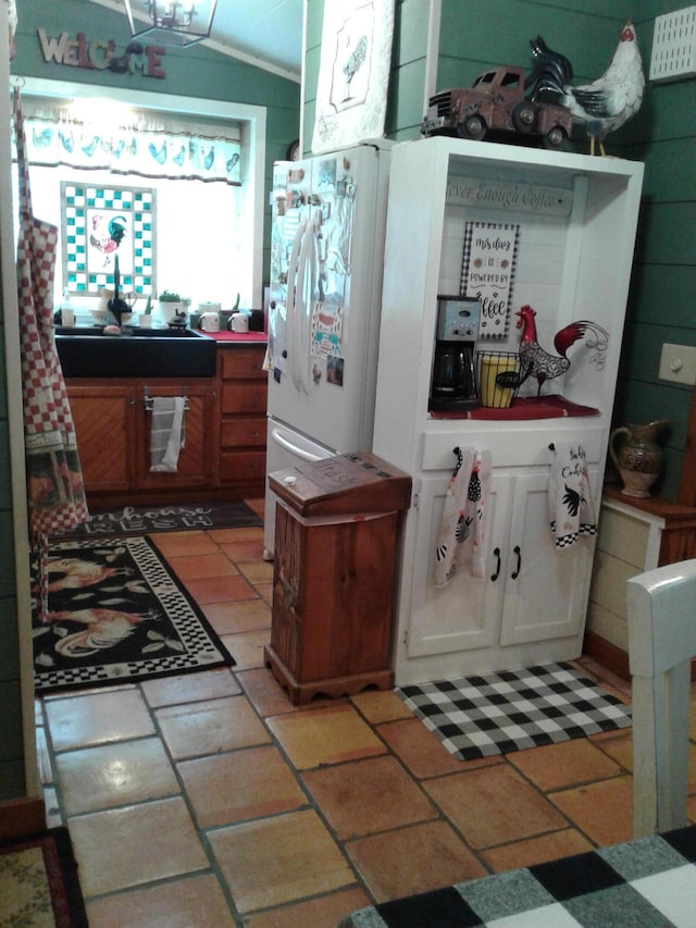 701 Spears Ave, Crane, MO 65633 - kitchen featuring tile counters and freestanding refrigerator