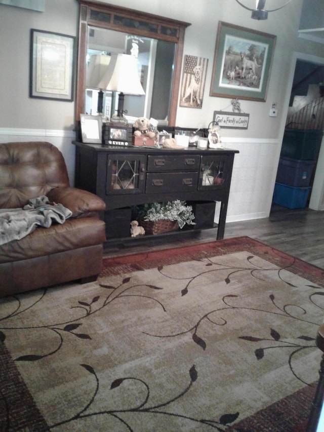 701 Spears Ave, Crane, MO 65633 - living room with wood finished floors and wainscoting