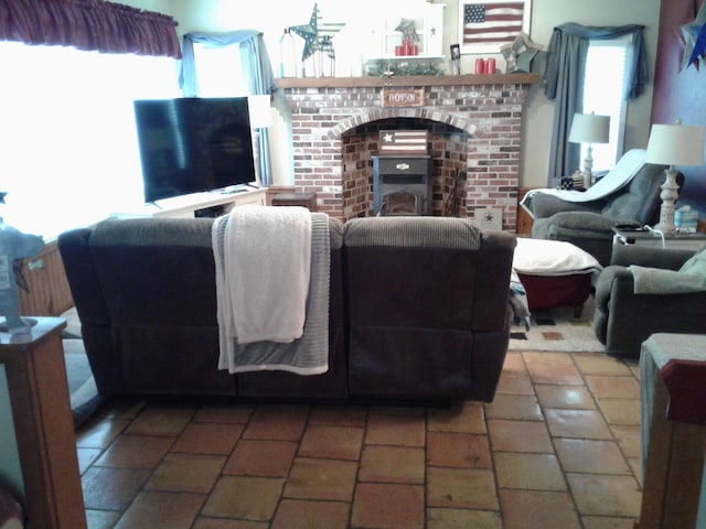 701 Spears Ave, Crane, MO 65633 - living room featuring plenty of natural light and a fireplace