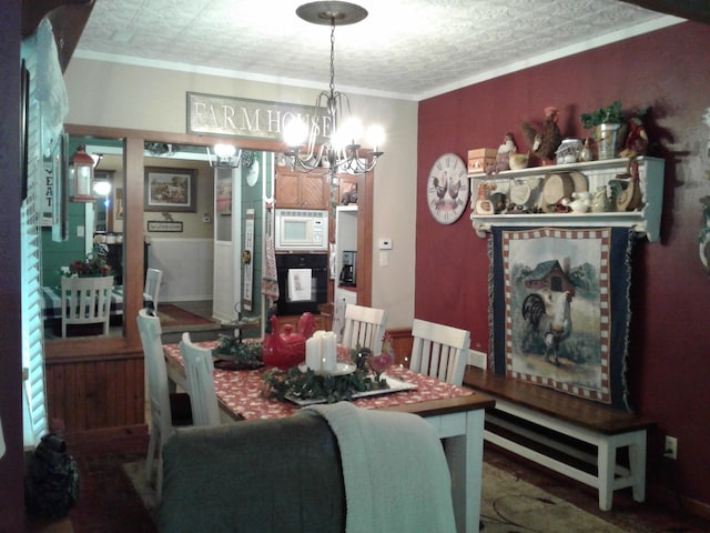 701 Spears Ave, Crane, MO 65633 - dining area featuring a chandelier and crown molding