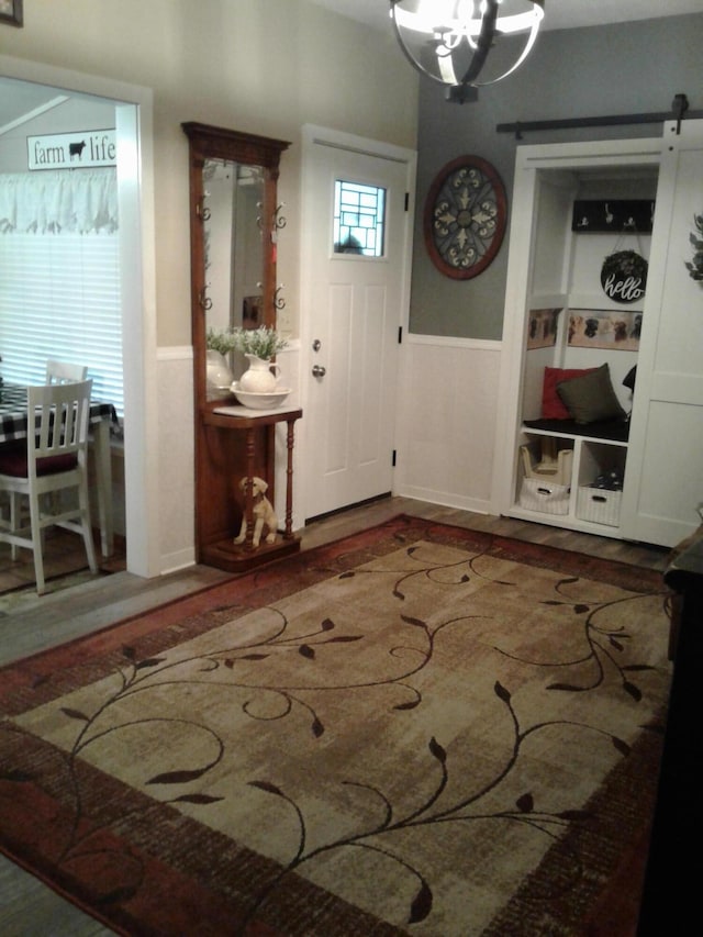 701 Spears Ave, Crane, MO 65633 - foyer featuring a wainscoted wall and wood finished floors