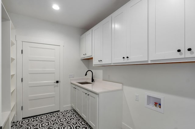 2124 N Silver Charm Ave, Springfield, MO 65802 - laundry room featuring cabinet space, hookup for a washing machine, tile patterned floors, and recessed lighting