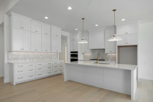 2124 N Silver Charm Ave, Springfield, MO 65802 - kitchen featuring backsplash, white cabinets, light countertops, light wood finished floors, and recessed lighting