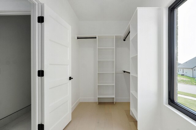 2124 N Silver Charm Ave, Springfield, MO 65802 - spacious closet with light wood finished floors