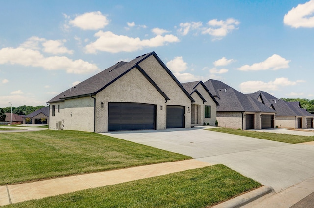 2124 N Silver Charm Ave, Springfield, MO 65802 - french country style house with brick siding, a garage, a front yard, driveway, and a shingled roof