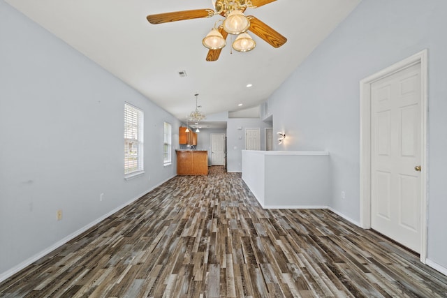 280 Quail Run Rd, Branson, MO 65616 - unfurnished living room with lofted ceiling, dark wood finished floors, ceiling fan, and a chandelier