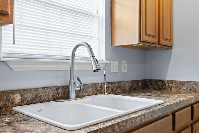 280 Quail Run Rd, Branson, MO 65616 - kitchen view of dark countertops and brown cabinetry