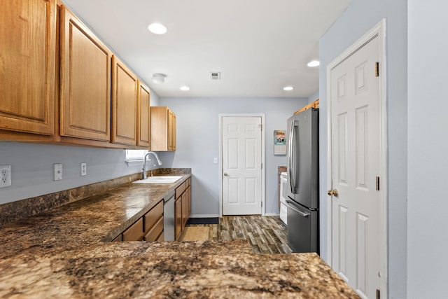 280 Quail Run Rd, Branson, MO 65616 - kitchen with stainless steel appliances, dark wood-type flooring, dark countertops, and recessed lighting