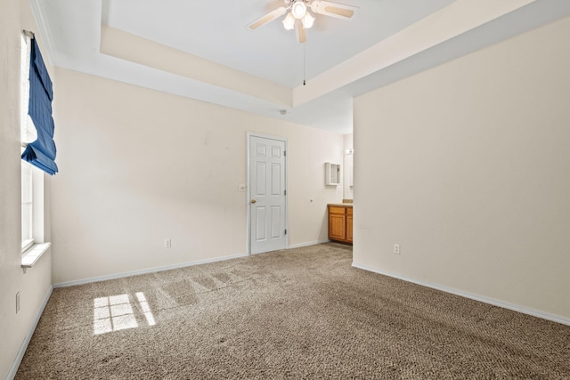 280 Quail Run Rd, Branson, MO 65616 - spare room featuring light colored carpet, a ceiling fan, and a raised ceiling