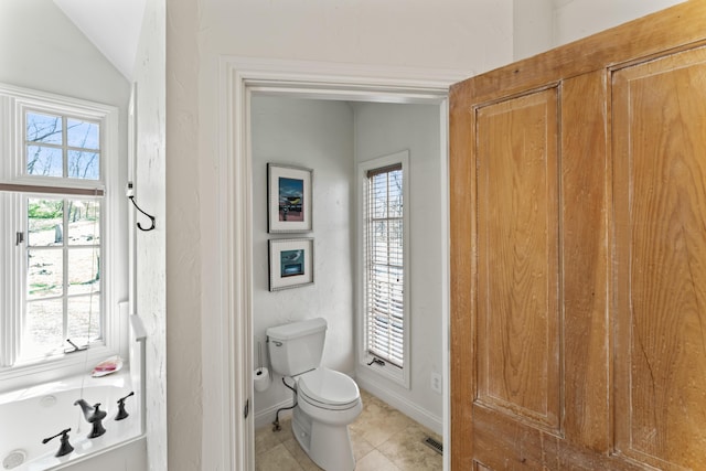 6420 E Turner Springs Rd, Springfield, MO 65809 - bathroom featuring tile patterned flooring, a bathtub, and vaulted ceiling