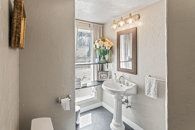 6420 E Turner Springs Rd, Springfield, MO 65809 - half bathroom featuring tile patterned floors, a textured ceiling, and a textured wall