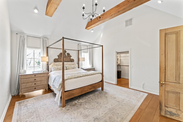 6420 E Turner Springs Rd, Springfield, MO 65809 - bedroom featuring a chandelier, wood finished floors, and a spacious closet