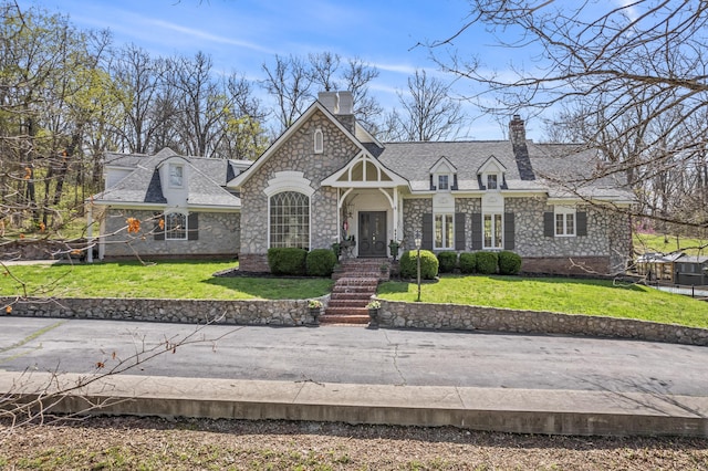 6420 E Turner Springs Rd, Springfield, MO 65809 - view of front of home with a chimney, a front yard, stone siding, and roof with shingles