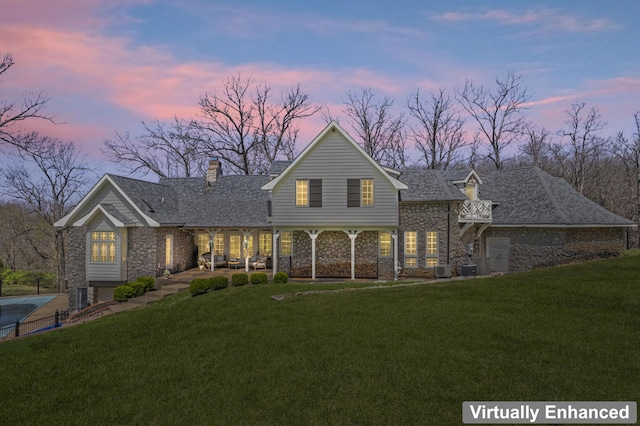 6420 E Turner Springs Rd, Springfield, MO 65809 - traditional-style home featuring stone siding, a chimney, a lawn, and roof with shingles