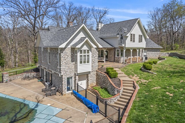 6420 E Turner Springs Rd, Springfield, MO 65809 - view of front of home featuring stone siding, an attached garage, concrete driveway, roof with shingles, and a chimney