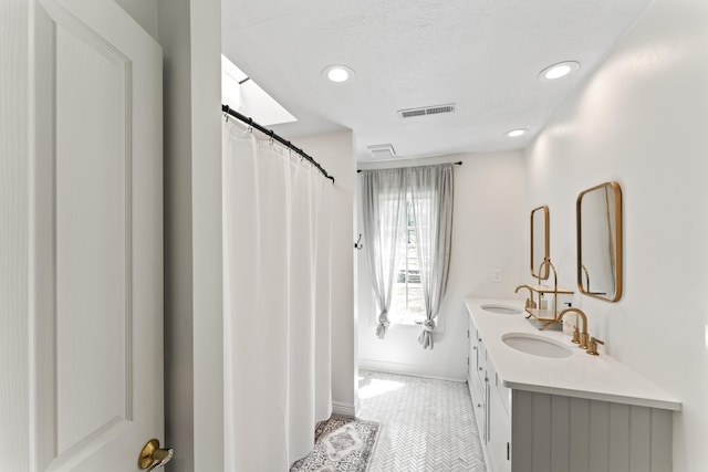 6420 E Turner Springs Rd, Springfield, MO 65809 - bathroom with double vanity, tile patterned flooring, and recessed lighting