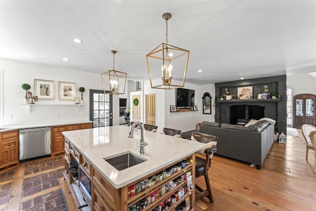 6420 E Turner Springs Rd, Springfield, MO 65809 - kitchen with dishwasher, brown cabinets, recessed lighting, a breakfast bar area, and light stone counters