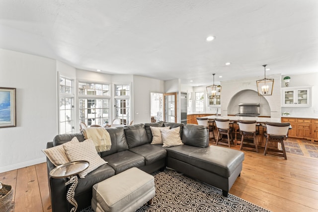 6420 E Turner Springs Rd, Springfield, MO 65809 - living room featuring light wood-style floors, recessed lighting, and a chandelier