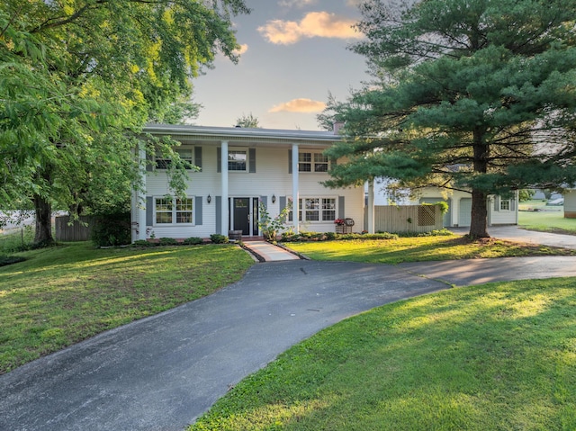 600 E Boone St, Ash Grove, MO 65604 - neoclassical / greek revival house with asphalt driveway and a porch