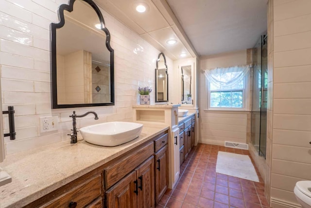 600 E Boone St, Ash Grove, MO 65604 - bathroom with a shower stall, vanity, and decorative backsplash