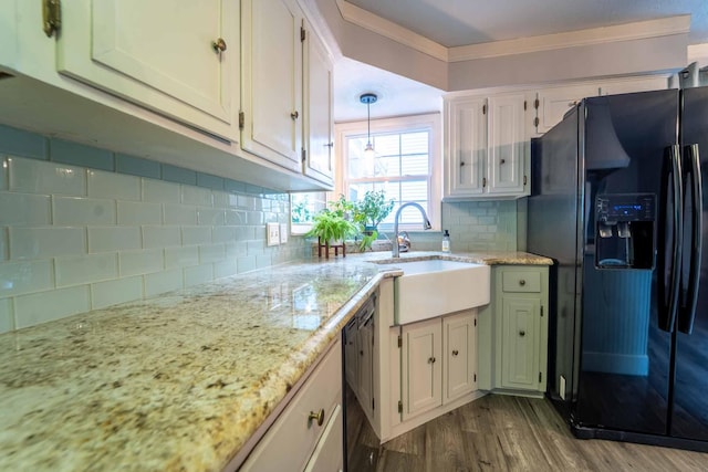600 E Boone St, Ash Grove, MO 65604 - kitchen featuring black fridge, dark wood finished floors, decorative backsplash, light stone counters, and white cabinets