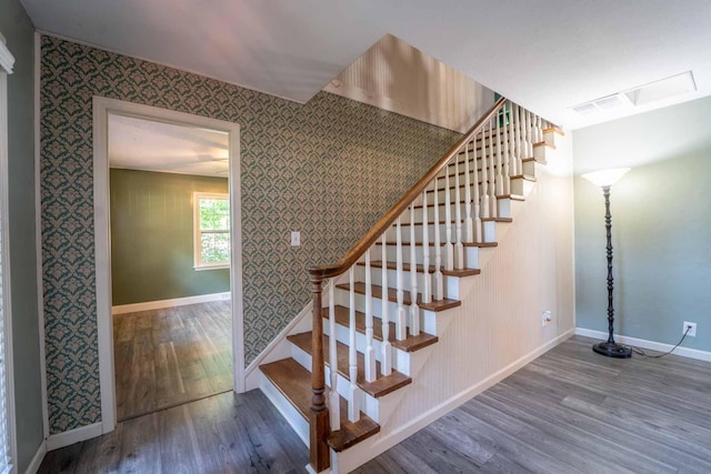 600 E Boone St, Ash Grove, MO 65604 - stairs with wood finished floors and wallpapered walls