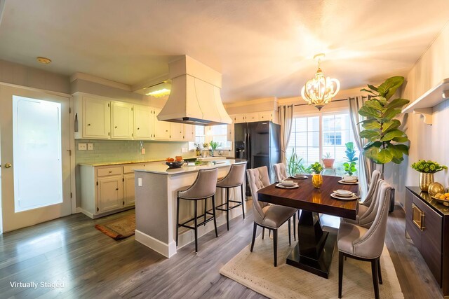600 E Boone St, Ash Grove, MO 65604 - dining space featuring a chandelier and dark wood-style floors