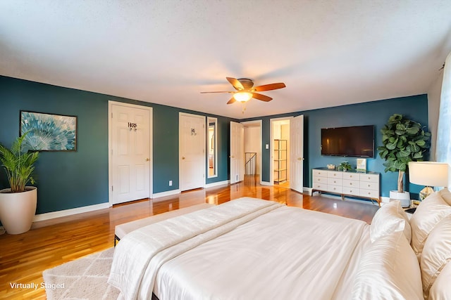 600 E Boone St, Ash Grove, MO 65604 - bedroom featuring wood finished floors and ceiling fan