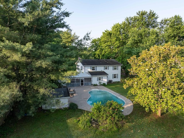 600 E Boone St, Ash Grove, MO 65604 - back of property with a yard, an outdoor pool, and a patio area